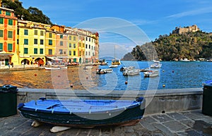 15.03.2018. facade of colorful old buildings and architecture with people walking on dock in small coastal village Portofino in Li