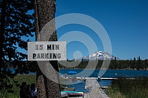 15 minute parking restriction sign at Oregons Lava Lake. Mt. Bachelor in background