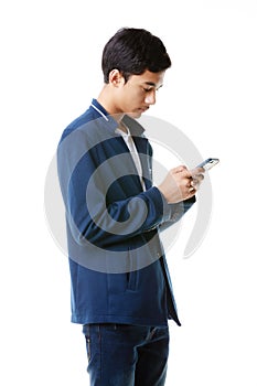 A 15-year-old Asian junior high school student holding and typing chat message on mobile phone screen to keep in touch with social