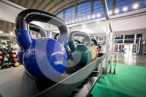 16 kilogram Kettlebells for exercise placed on shelf in gym