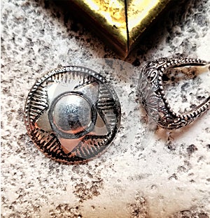161794459 Silver Jewelry from Santa Feâ–ª silver stirrup ear rings and south western deputy pendant. A gold frame corner sample.