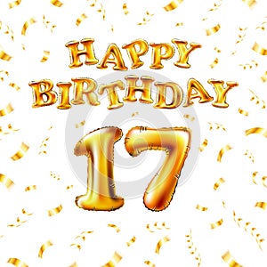 17 Happy Birthday message made of golden inflatable balloon seventeen letters isolated on white background fly on gold ribbons