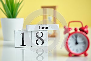 18 eighteenth day june Month Calendar Concept on Wooden Blocks