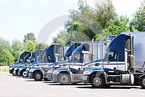 18 wheelers parked in a row.
