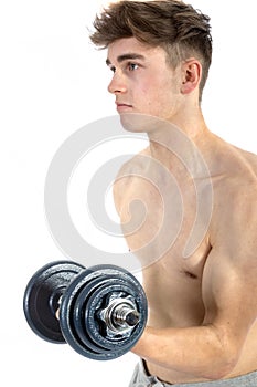 18 Year old teenage boy lifting weights
