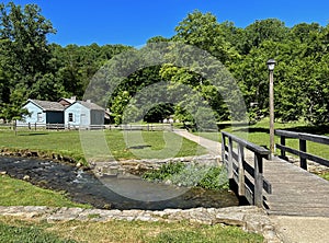 1800 Historic Buildings and a Foot Bridge over the creek in Spring Mill State Park