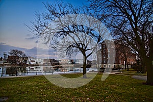 1867 Wapsipinicon Flour Mill and historic downtown Independence IA reflecting in the river.