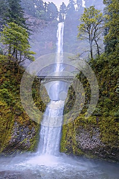 The 189 meter high Multnomah falls on a misty day in the Columbia River Gorge, Oregon