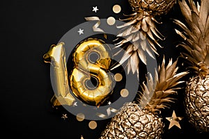 18th birthday celebration background with gold balloons and golden pineapples