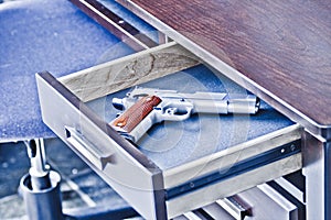 1911 handgun in drawer