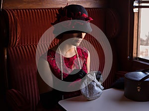 1920s woman in train compartment