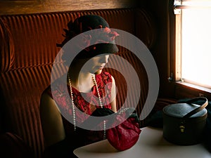 1920s woman at train window