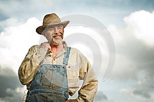 1930s farmer smiling at the Sun photo