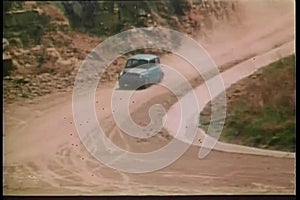 1970s car driving on dirt road