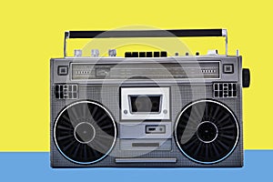 1980s Silver retro radio boom box on color background