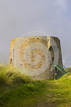 The 19th century round Martello tower fort built in the sand dunes at Magilligan Point near Limavady in County Derry in Northern I