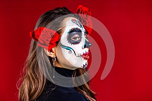 1st and 2nd november celebration of day of the dead in mexico concept woman with grimm skull face and black cloth in