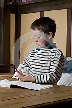 1st grade boy doing homework