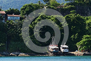 2/19/2022 - Ilhabela, Brazil - Fishing boats on land at the island of Ilhabela, Brazil