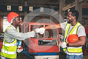 2 African American man Used hand for fist bump to show their cooperation For success teamwork