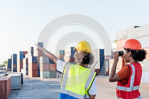 2 African American workers woman, are working in containers industry