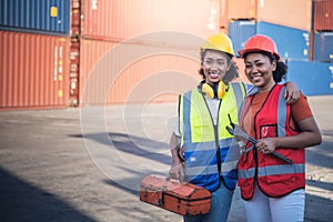 2 African American workers women, Standing and holding tools for maintenance