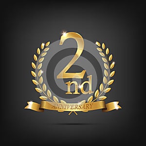 2 anniversary golden symbol. Golden laurel wreaths with ribbons and second anniversary year symbol on dark background