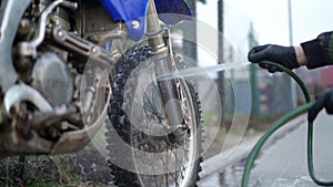 2 April 2020 Chelmsko Slaskie. Young man washes motocross Yamaha Wr 250WR