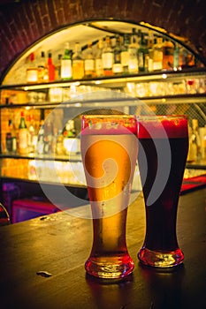 2 beer glasses at the bar counter