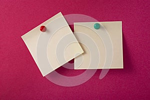 2 blank yellow adhesive notes on red