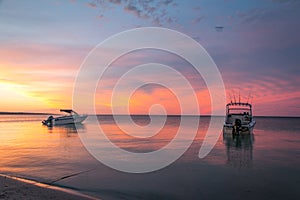 2 boats anchored in the ocean at Dunsborough Western Australia at Sunset