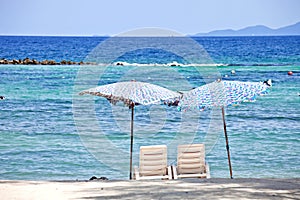 2 Chairs on beach in front of the sea