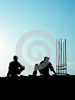 2 Construction Workers at work in Silhoutte
