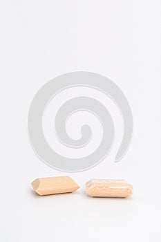 2 creamy color soaps in studio light on white background. one none wrap and another one is. Clipping Paths