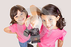 2 Cute Happy young girls celebrating Ramadan with their lantern