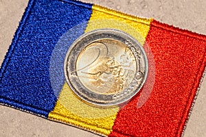 2 euro coin and Romanian flag Concept, Conversion of Romanian lei to euro, Adoption of the common European currency by Romania
