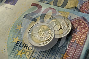 2 euro coins on 20 euro banknotes. Eurozone currency.