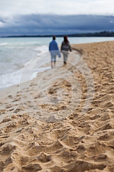 2 females on beach walk