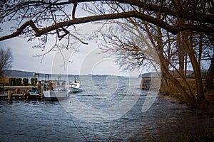 2 fishing boats lying on the shore during storm