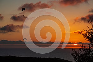 2 gliders coasting the California sunset over the Pacific Ocean in La Jolla