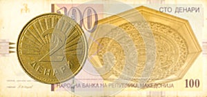 2 macedonian denar coin against 100 macedonian denar bank note