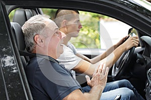 2 men driving car