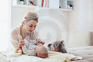 2 month old baby with mom and dog