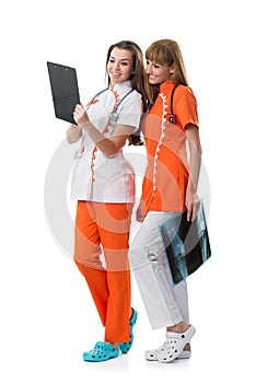 2 pretty nurse looking at the x-ray findings