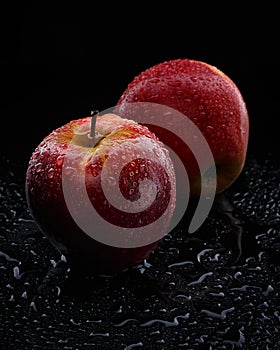 2 red apple with water drops