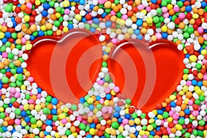 2 Red heart surrounded by colourful candy balls