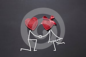 2 red hearts on a black board, chalk inscription `I love you`, background for Valentine`s Day, declaration of love, engagement