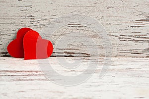 2 red Love hearts on  white-painted wooden texture background with horizontal copyspace