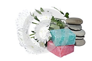 2 soaps and 5 stones and white flowers