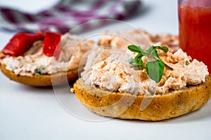 2 toast with salmon spread and fresh cheese, juice and cloth